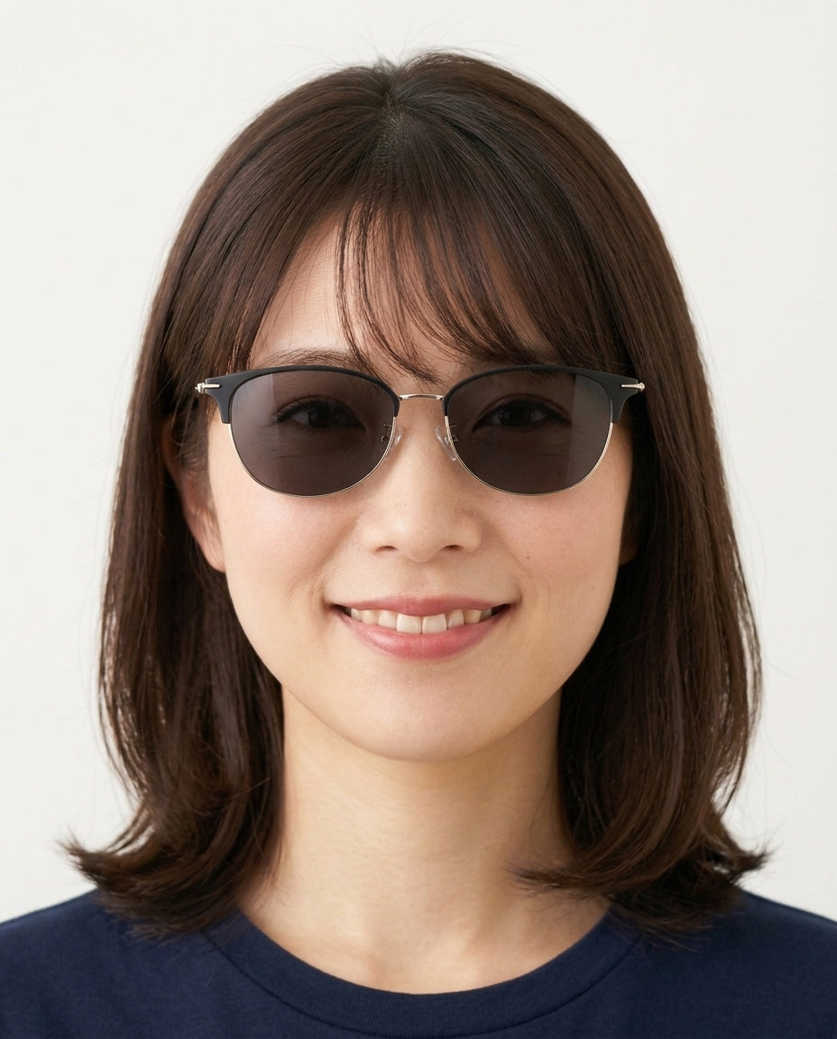 Model wearing Dormann Sun Kingston eyebrow round sunglasses in Black/Shiny Gold